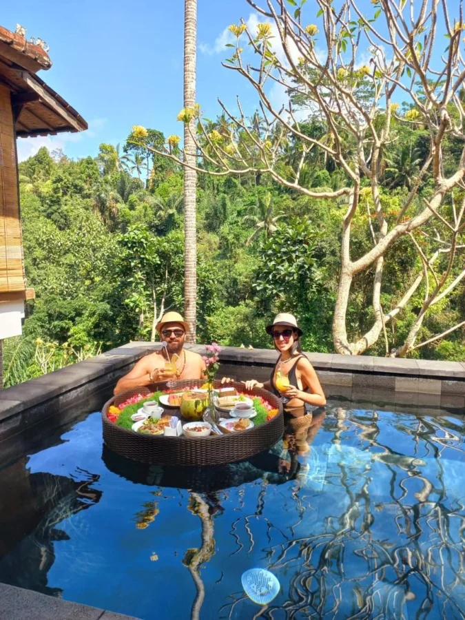 Travellers enjoying a floating breakfast in Bali